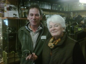 Marion having her reel fixed by the manager at Game Fishing Supplies