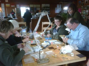 Paul little tying flies with ladies fishing November 2009
